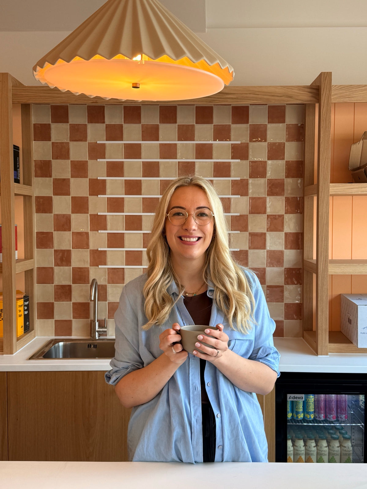 Hope, founder of Chummys Bakery, enjoying a coffee in the Droitwich shop