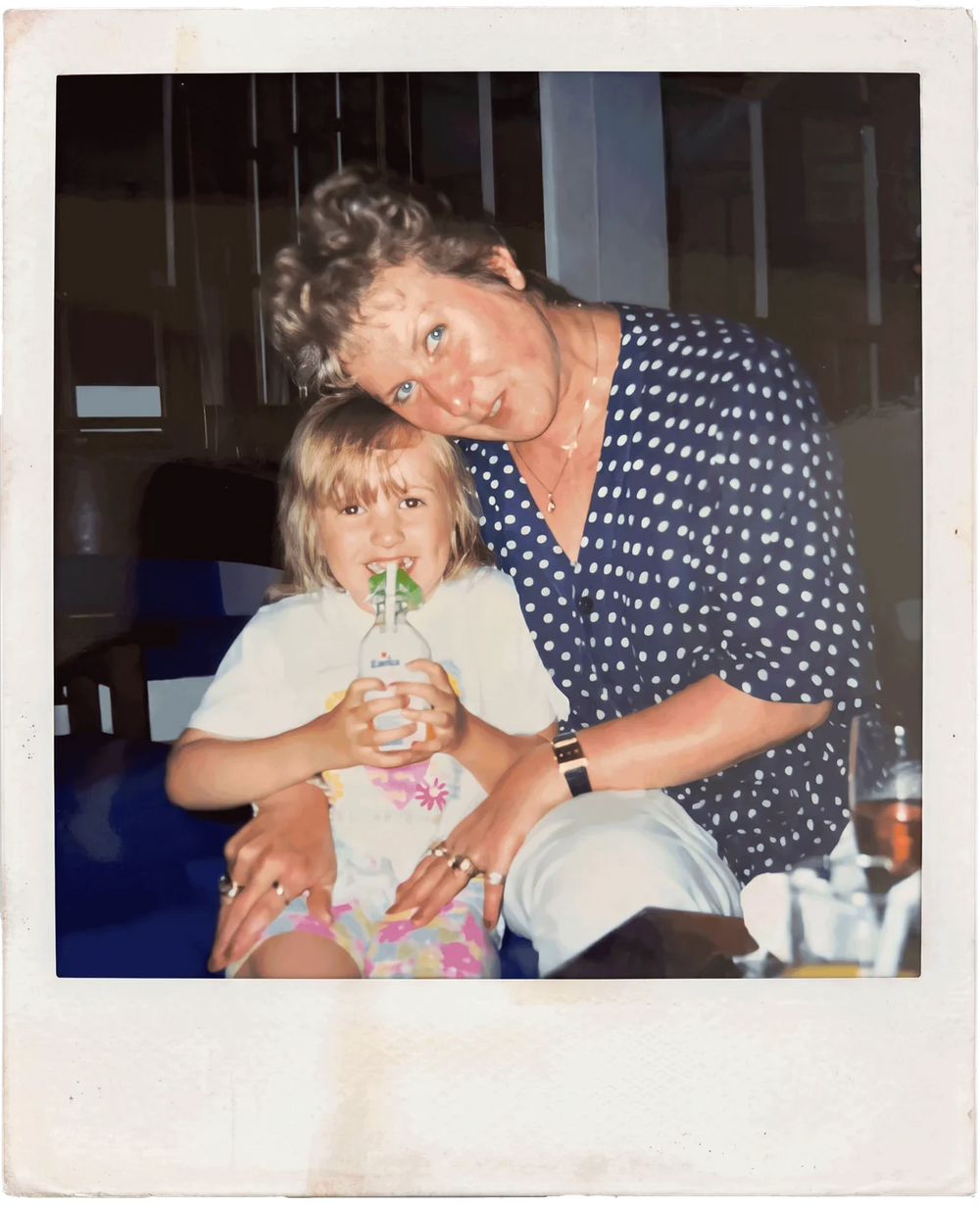 A polaroid of Hope as a little girl on her nan's lap