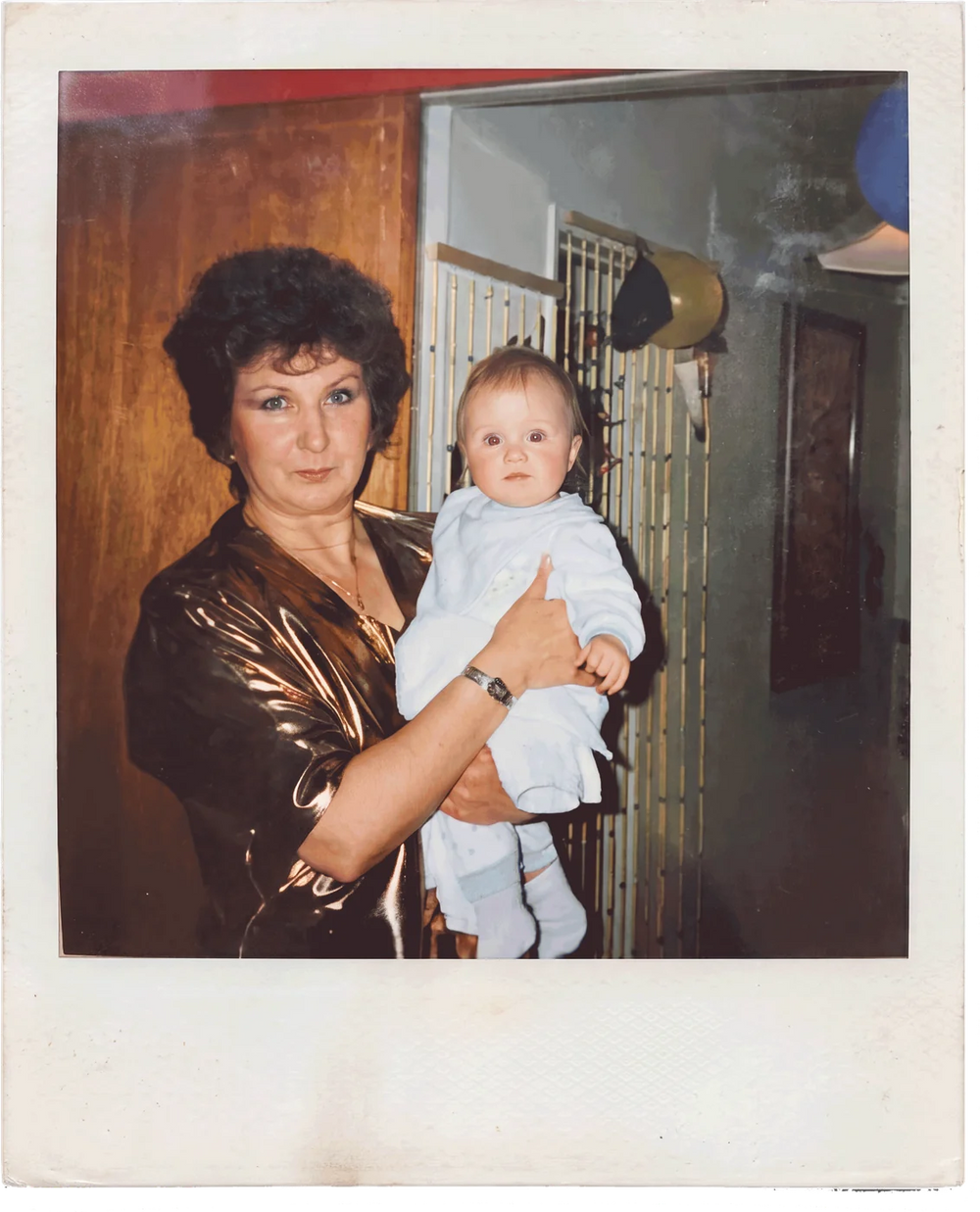 A polaroid of Hope as a baby, held by her nan
